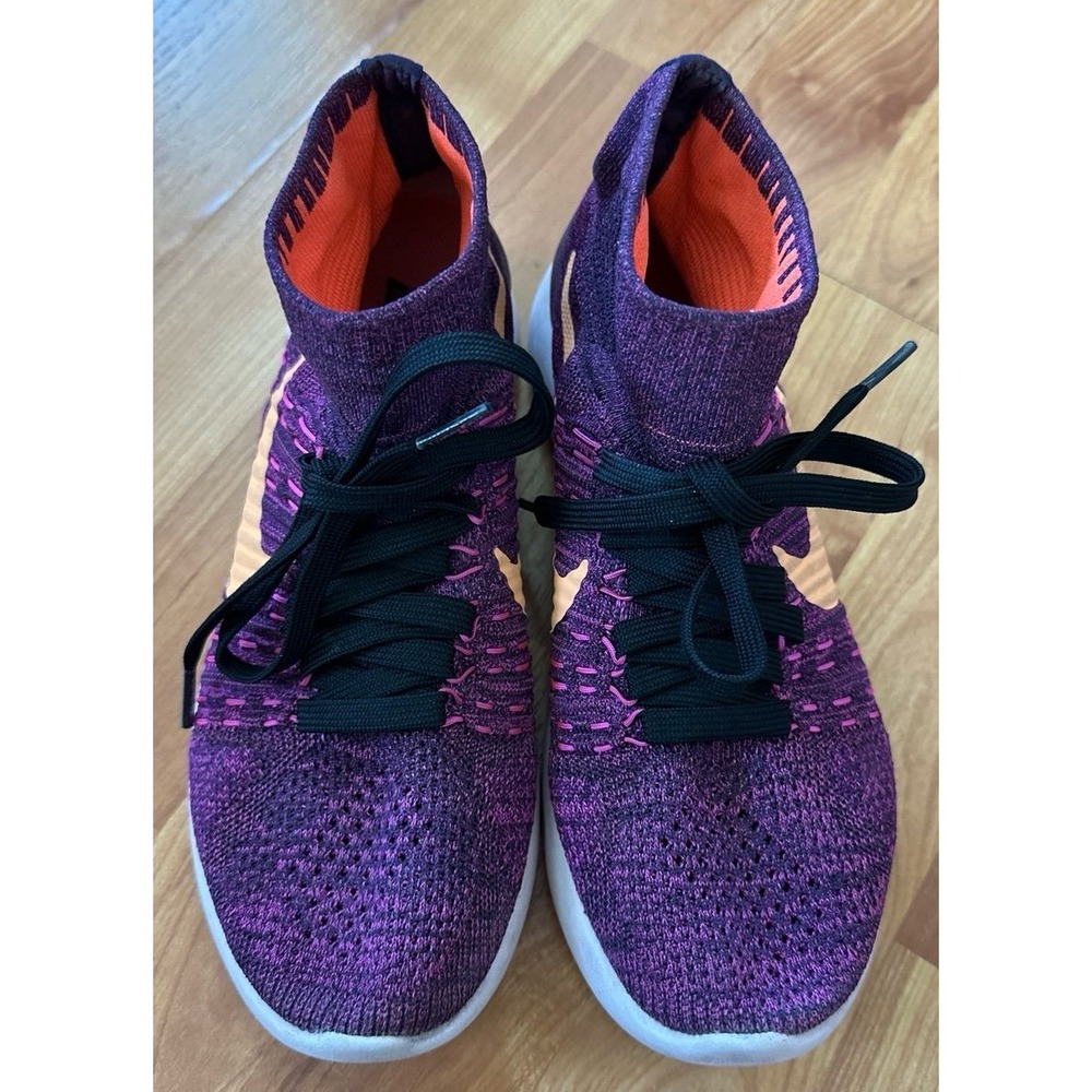 Nike LunarEpic Flyknit running shoes in a purple colorway with an orange swoosh.